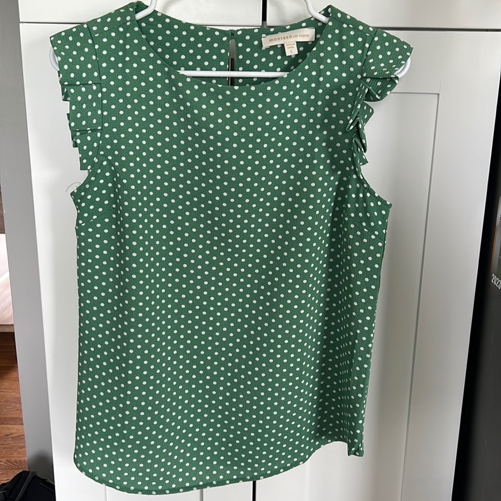 A cute green and white polka dot blouse